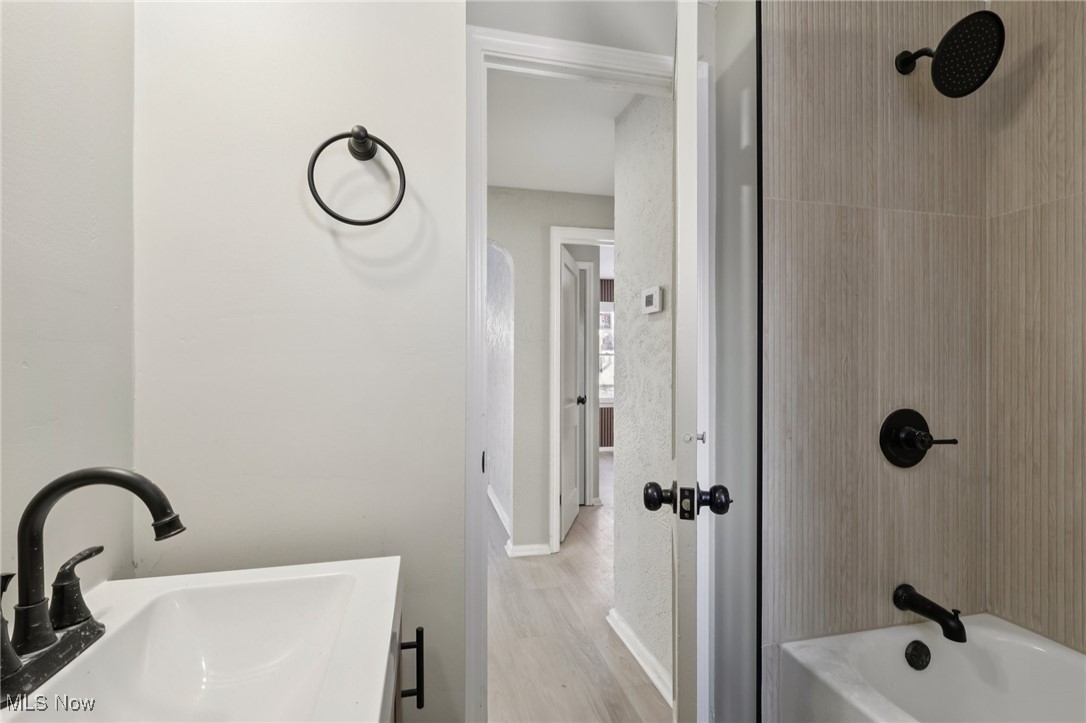 21316 Watson Road Maple Heights, OH 44137 - Photo 12 of 23 Full bathroom with a sink and shower combination