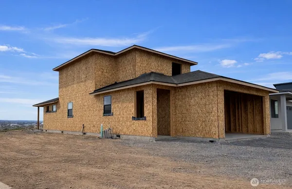 a house with trees in the background