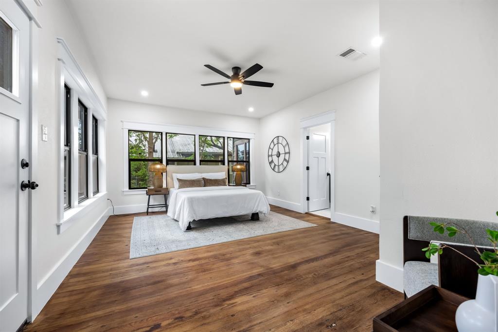 1014 Bolivar Street Denton, TX 76201 - Photo 21 of 36 a bedroom with furniture and a wooden floor