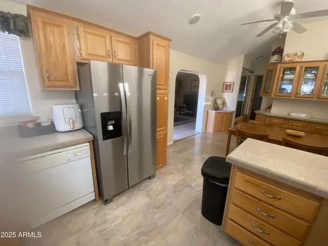 a kitchen with stainless steel appliances a refrigerator and a stove