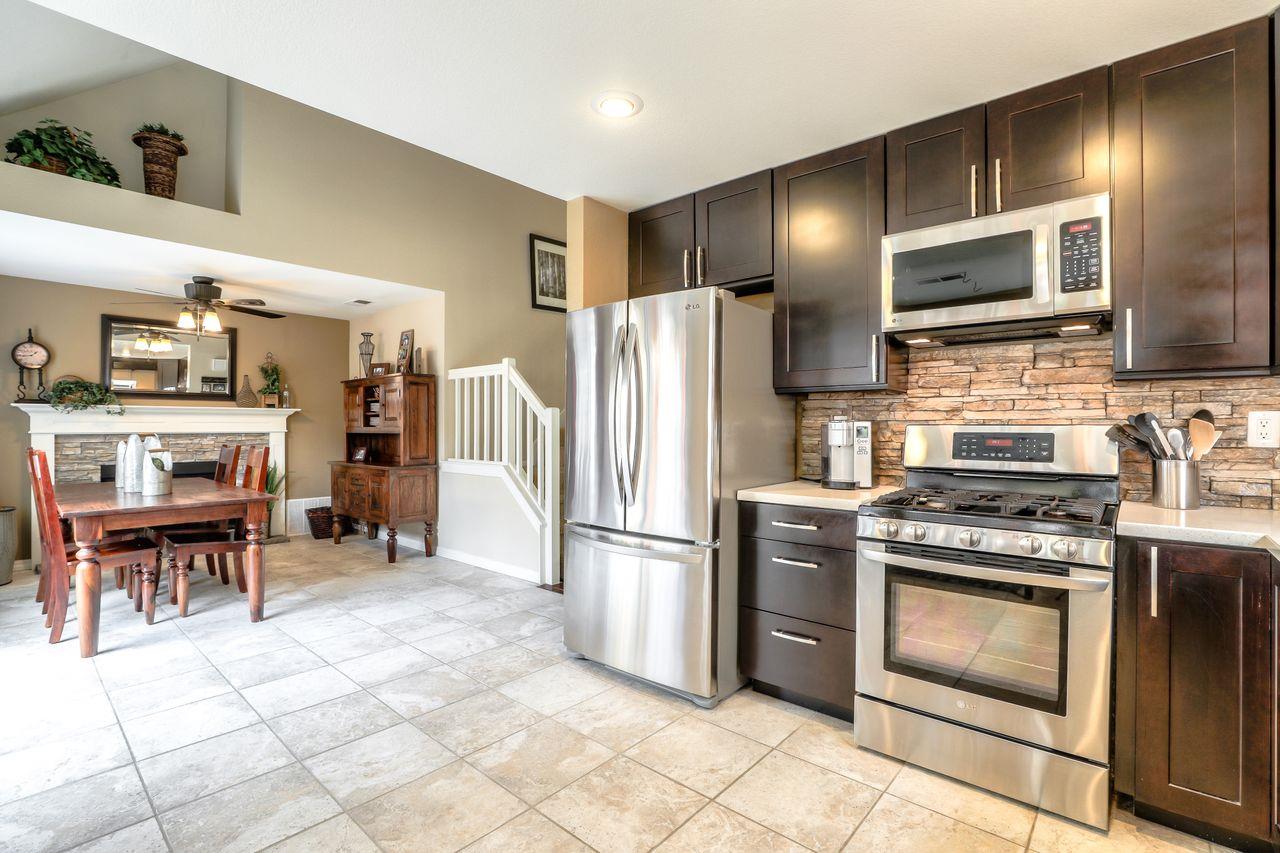 1645 Klipspringer Drive San Jose, CA 95124 - Photo 12 of 47 a kitchen with stainless steel appliances granite countertop a refrigerator stove and sink