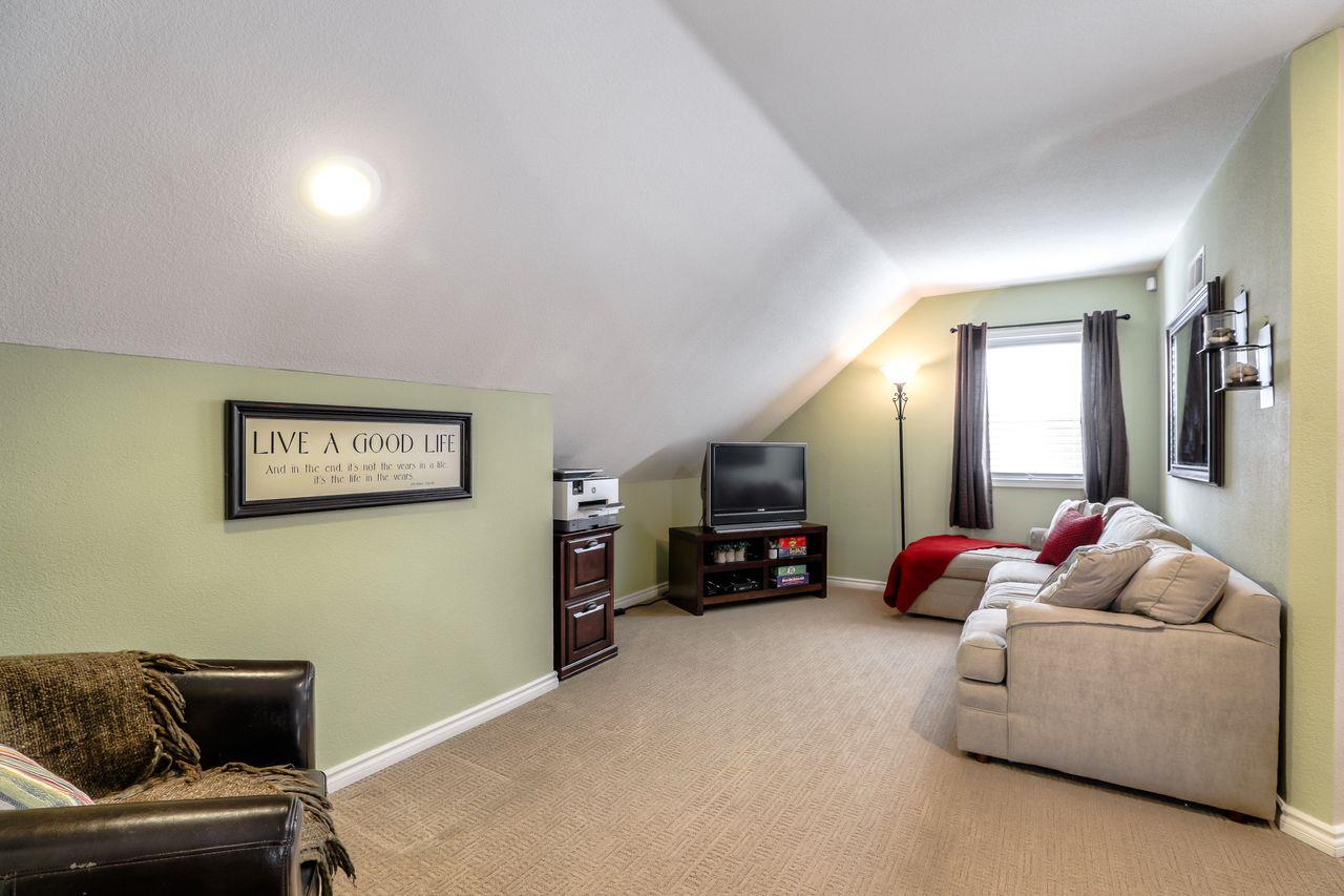 1645 Klipspringer Drive San Jose, CA 95124 - Photo 19 of 47 a living room with furniture and a flat screen tv