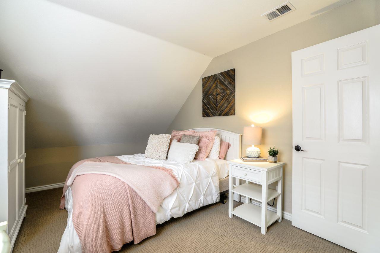 1645 Klipspringer Drive San Jose, CA 95124 - Photo 31 of 47 a bedroom with a bed and a wall painting