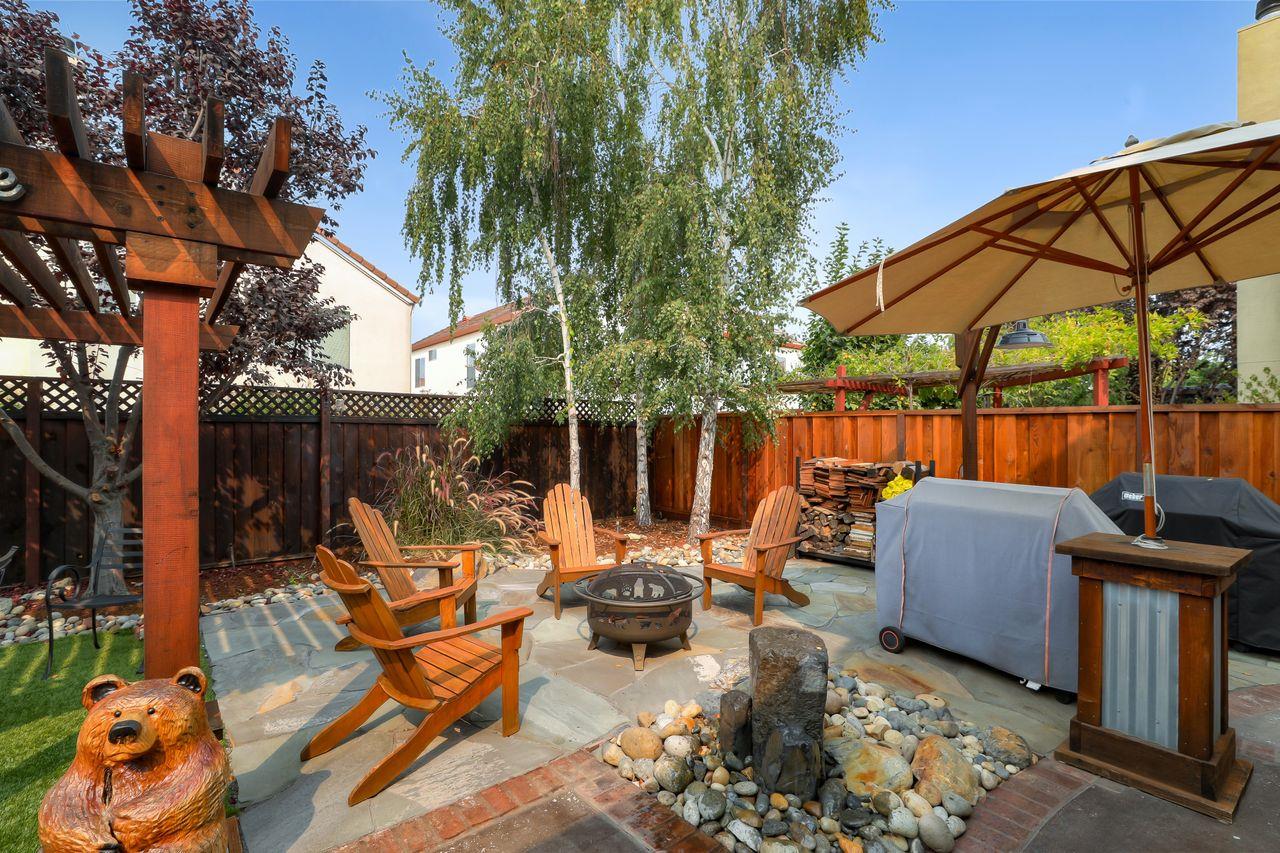 1645 Klipspringer Drive San Jose, CA 95124 - Photo 35 of 47 an outdoor sitting area with furniture and umbrella