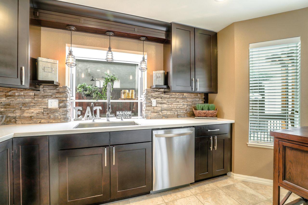 1645 Klipspringer Drive San Jose, CA 95124 - Photo 10 of 47 a kitchen with stainless steel appliances granite countertop a sink and a stove