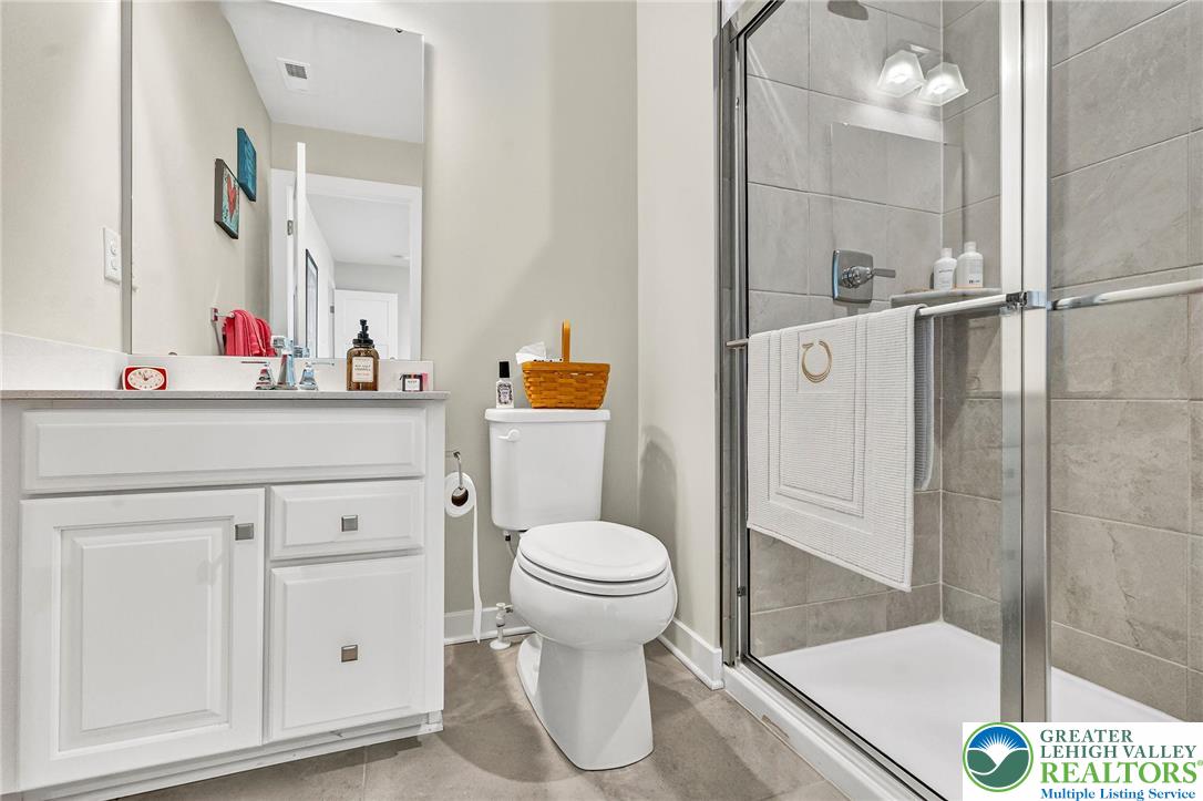 1606 Watson Loop Fogelsville, PA 18051 - Photo 22 of 76 a bathroom with a sink toilet and shower