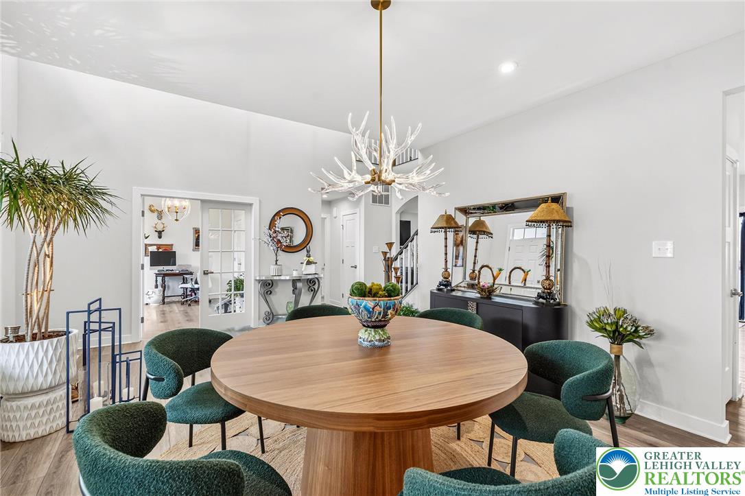 1606 Watson Loop Fogelsville, PA 18051 - Photo 29 of 76 a dining room with furniture a chandelier and window