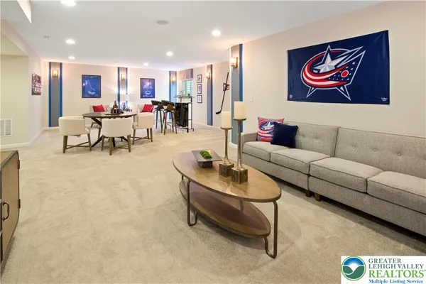 a living room with furniture and kitchen view