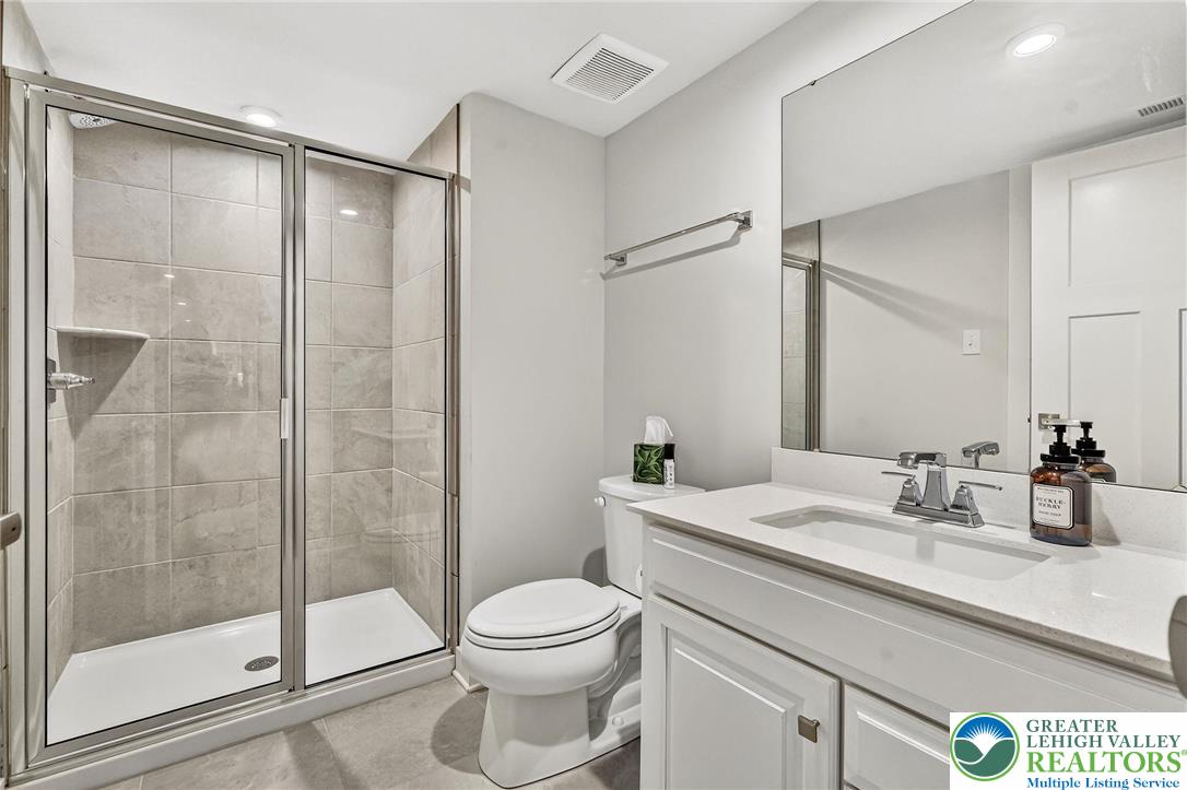 1606 Watson Loop Fogelsville, PA 18051 - Photo 49 of 76 a bathroom with a sink a toilet and shower