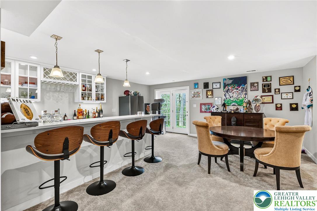 1606 Watson Loop Fogelsville, PA 18051 - Photo 56 of 76 a living room with furniture and a chandelier