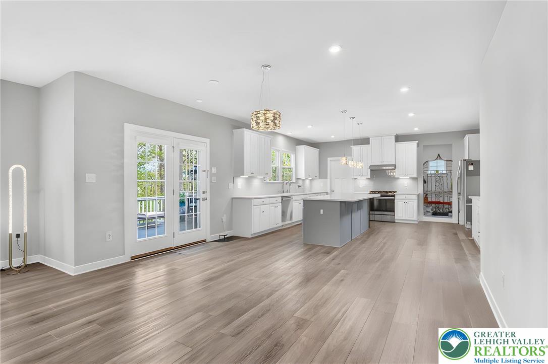 1606 Watson Loop Fogelsville, PA 18051 - Photo 68 of 76 a view of large kitchen with wooden floor and windows