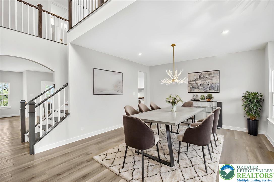1606 Watson Loop Fogelsville, PA 18051 - Photo 70 of 76 a view of a dining room with furniture window and wooden floor