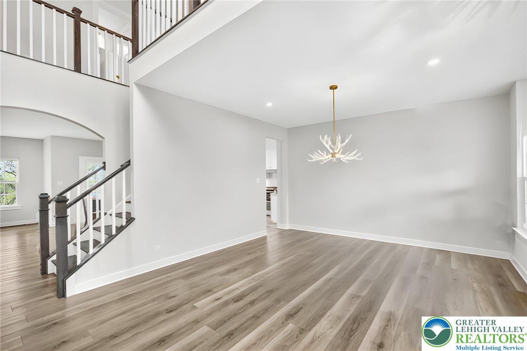 1606 Watson Loop Fogelsville, PA 18051 - Photo 71 of 76 wooden floor in an empty room with a window