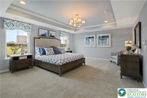 a bedroom with a bed and a couch