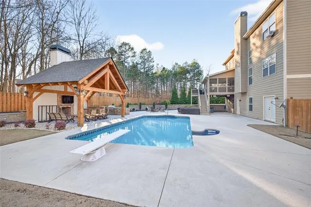 a view of a house with a yard and sitting area