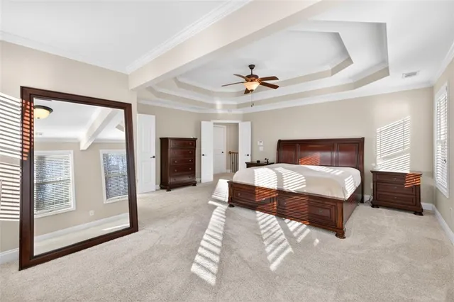 a bathroom with a tub a double vanity sink a mirror and a shower