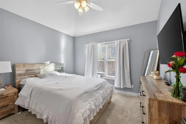 a view of a livingroom with wooden floor and stairs