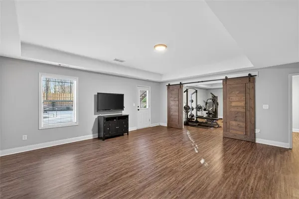 a living room with furniture a fireplace and a table