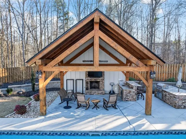 a view of house with yard in front of it