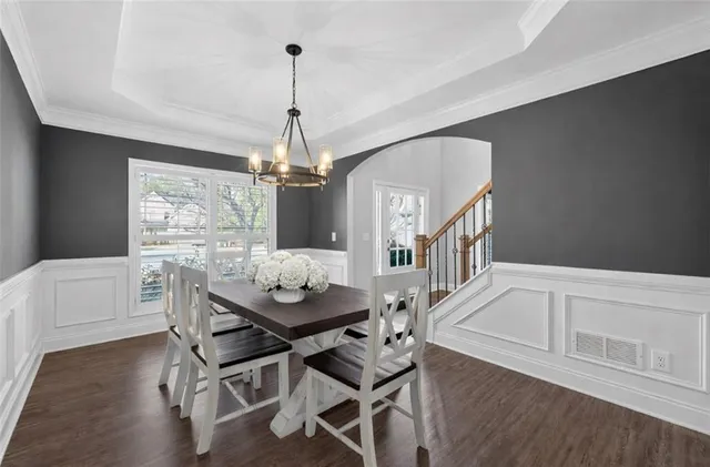 a view of a dining room with furniture window and wooden floor