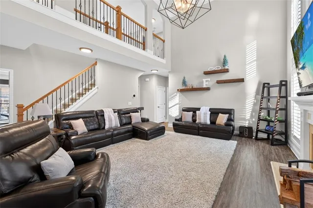a living room with furniture fireplace and a flat screen tv
