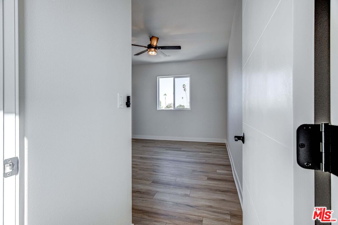 624 West 83rd Street, Unit 624 Los Angeles, CA 90044 - Photo 19 of 26 wooden floor in an empty room