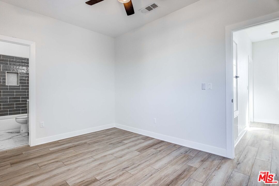 624 West 83rd Street, Unit 624 Los Angeles, CA 90044 - Photo 26 of 26 wooden floor in an empty room