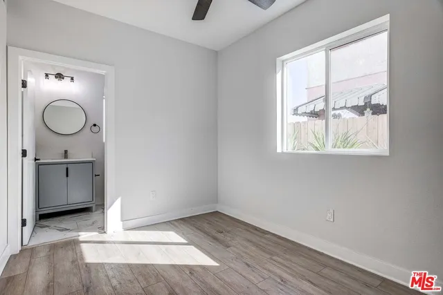 a view of a bathroom with a sink and a window