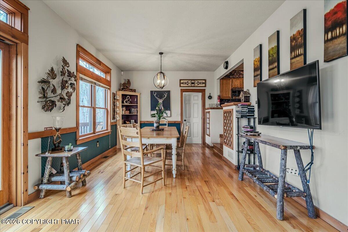 723 Lower Deer Valley Road Tannersville, PA 18372 - Photo 11 of 58 a view of a dining room with furniture and wooden floor