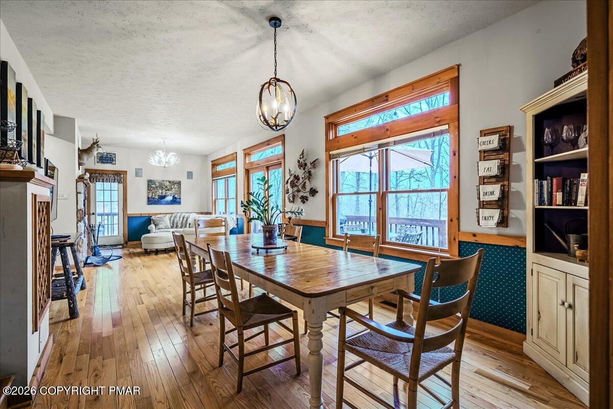 723 Lower Deer Valley Road Tannersville, PA 18372 - Photo 12 of 58 a view of a dining room with furniture window and wooden floor