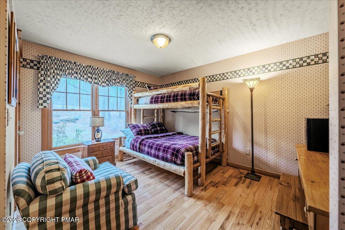 723 Lower Deer Valley Road Tannersville, PA 18372 - Photo 17 of 58 a bedroom with a bed and a window