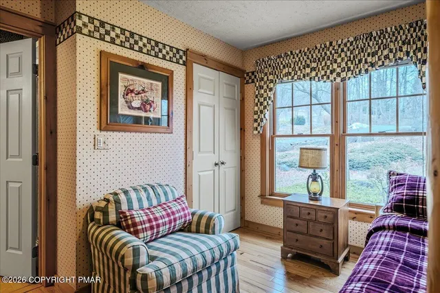 a bedroom with a bed and a desk