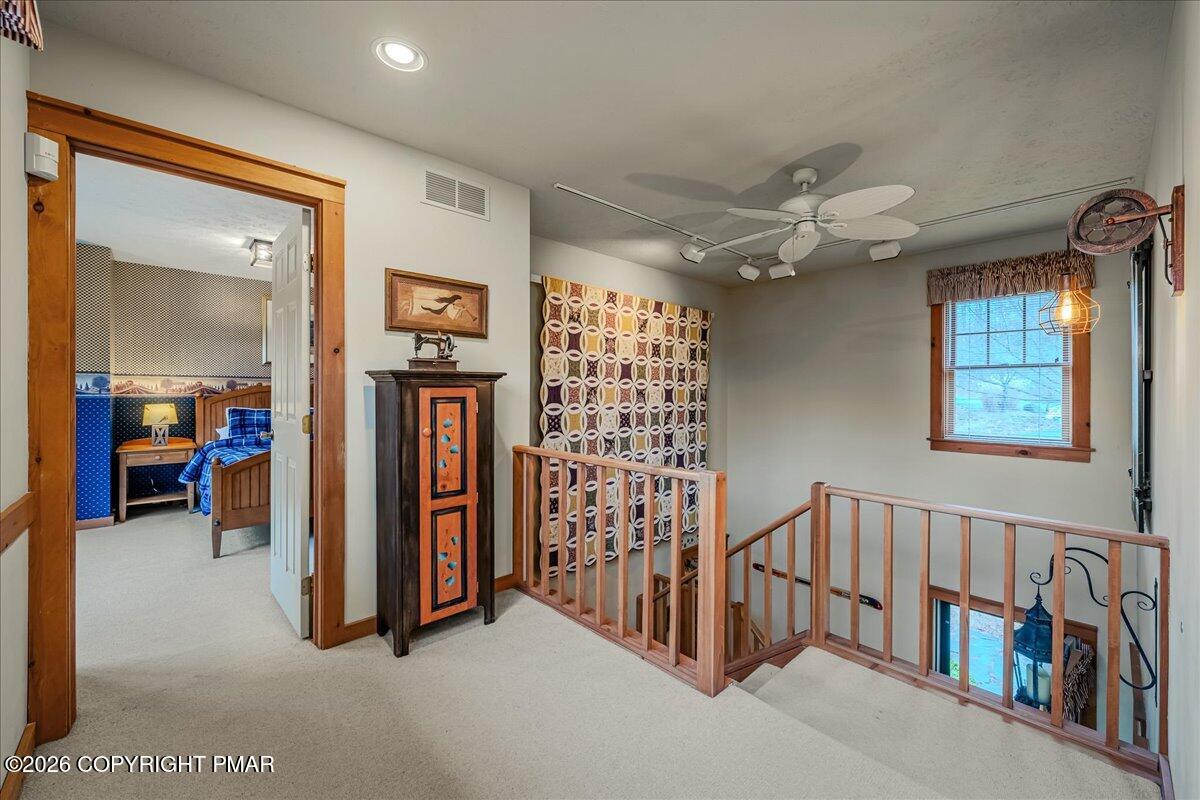 723 Lower Deer Valley Road Tannersville, PA 18372 - Photo 23 of 58 a view of a livingroom with furniture and staircase