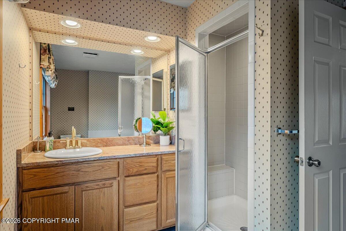723 Lower Deer Valley Road Tannersville, PA 18372 - Photo 30 of 58 a bathroom with a sink and a mirror