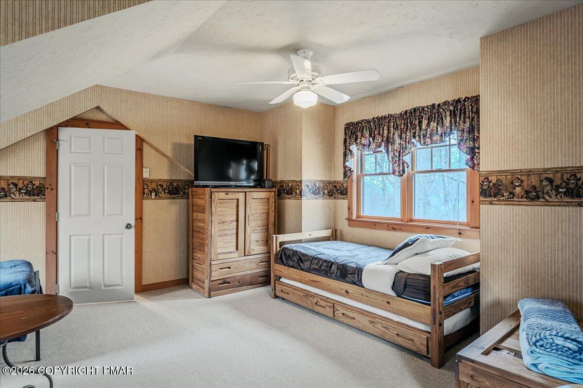 723 Lower Deer Valley Road Tannersville, PA 18372 - Photo 33 of 58 a bedroom with bed and flat tv screen