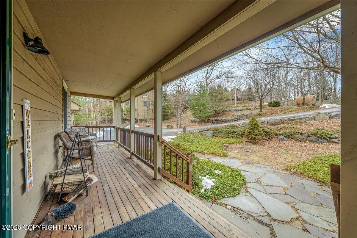 723 Lower Deer Valley Road Tannersville, PA 18372 - Photo 49 of 58 a view of a balcony with mountain view and wooden floor