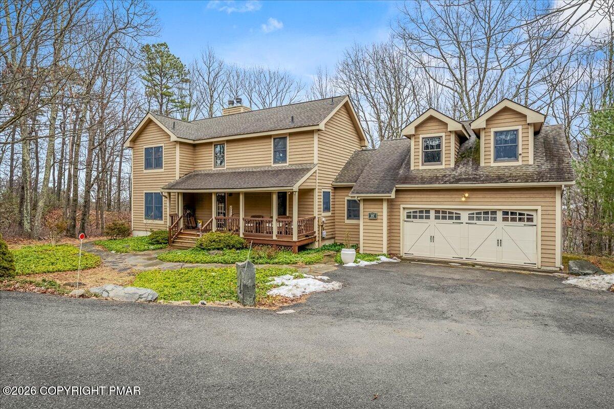 723 Lower Deer Valley Road Tannersville, PA 18372 - Photo 50 of 58 a front view of a house with a yard and garage
