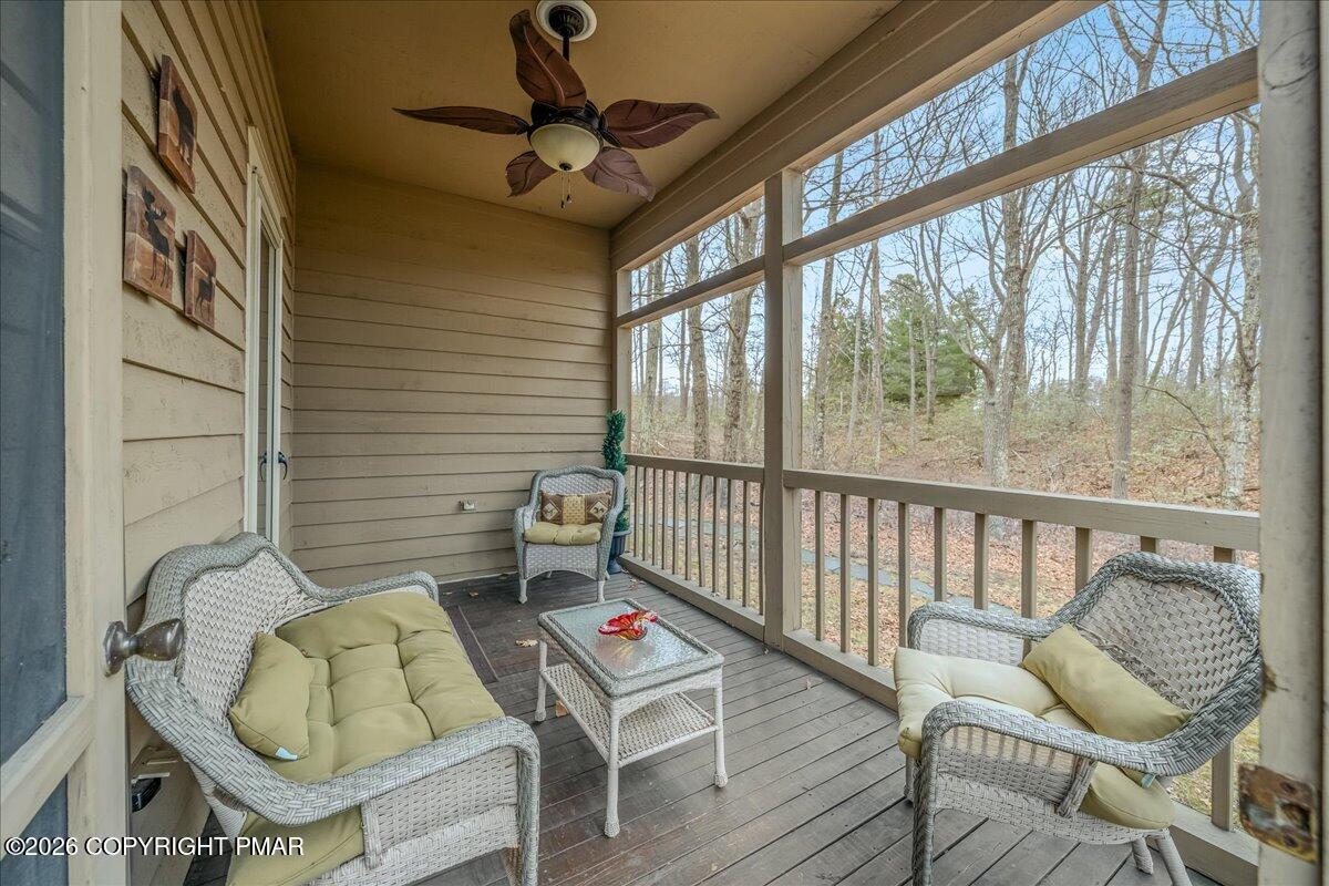 723 Lower Deer Valley Road Tannersville, PA 18372 - Photo 9 of 58 a balcony with furniture and wooden floor