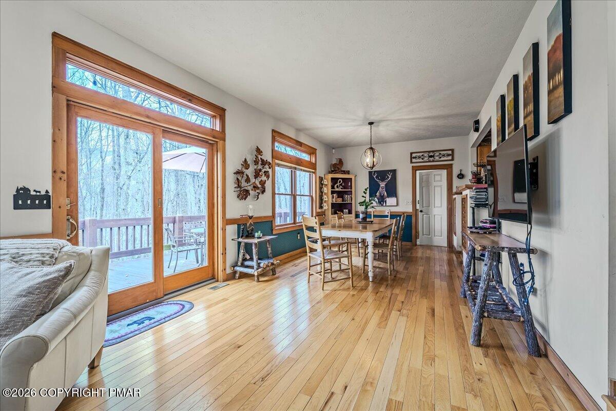 723 Lower Deer Valley Road Tannersville, PA 18372 - Photo 10 of 58 a living room with furniture and a wooden floor
