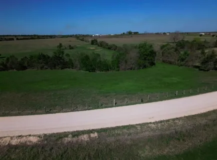 a view of a yard and an ocean