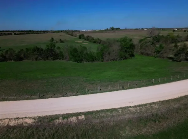 a view of a yard and an ocean