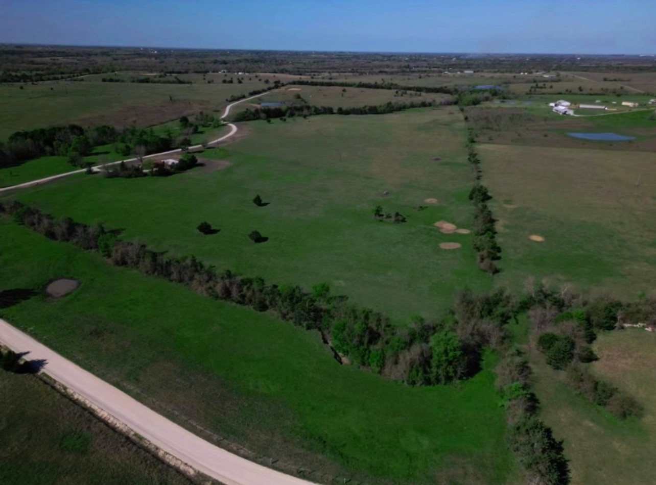 1 Caney Creek Road Chappell Hill, TX 77426 - Photo 9 of 9 a view of a lake with a yard