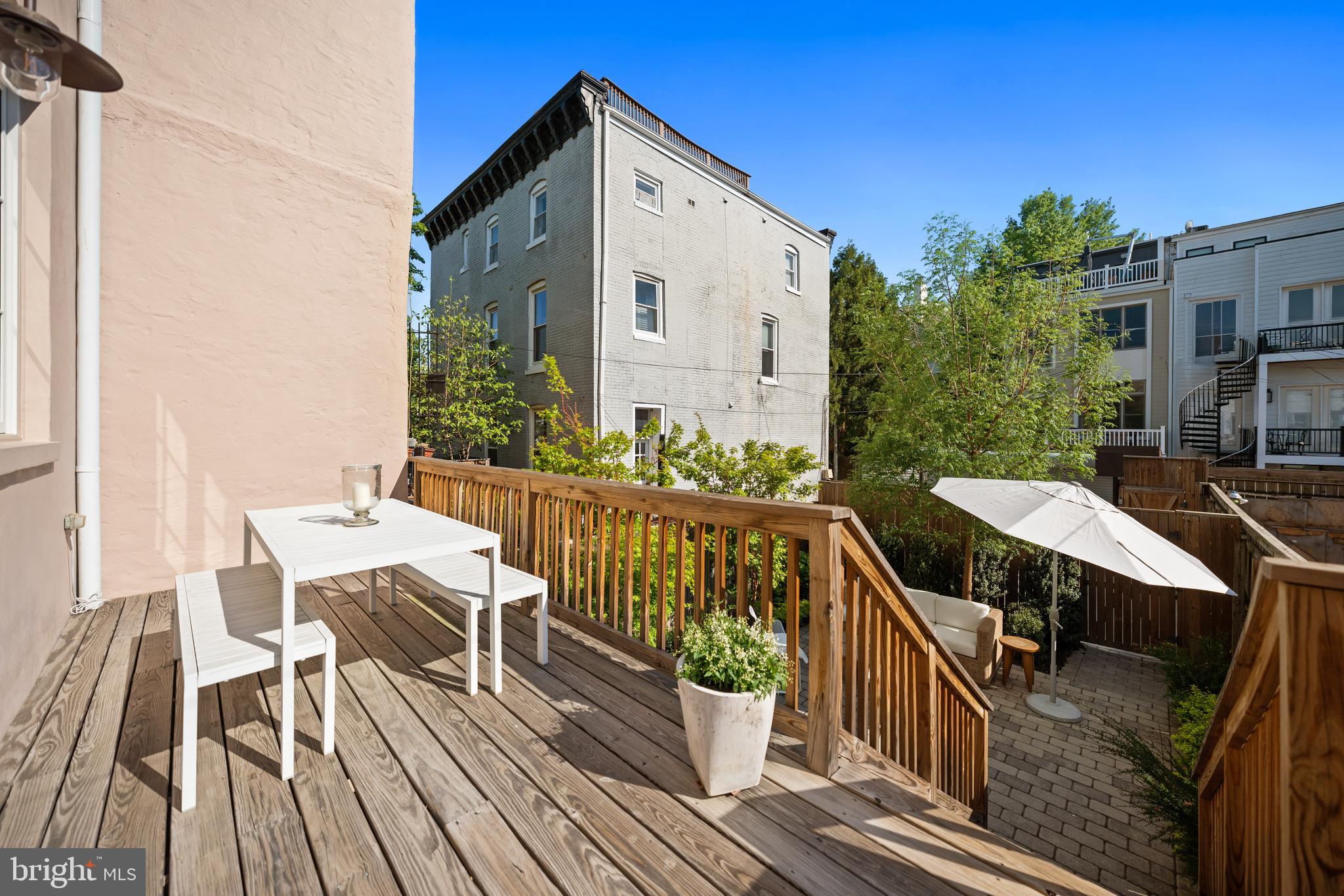 1304 S Street Northwest Washington, DC 20009 - Photo 21 of 23 a view of a balcony with wooden floor and outdoor seating