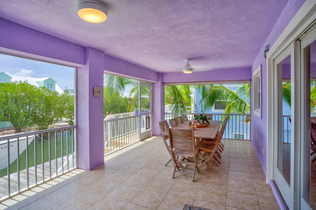 a dining room with furniture and garden view