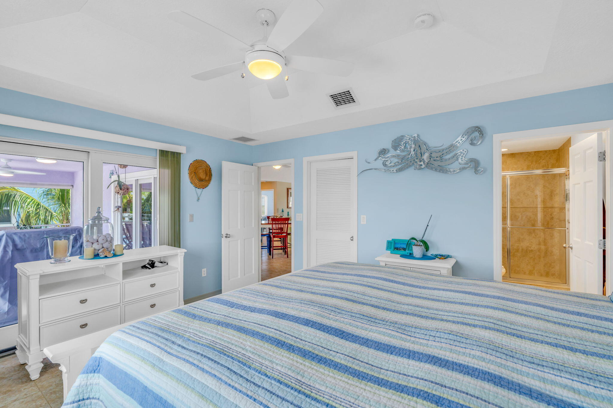 823 Indies Road Summerland Key, FL 33042 - Photo 17 of 48 a bedroom with a bed and a window