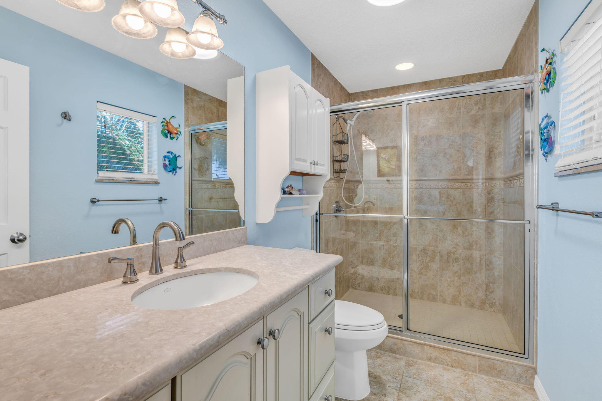 823 Indies Road Summerland Key, FL 33042 - Photo 20 of 48 a bathroom with a granite countertop sink toilet and shower