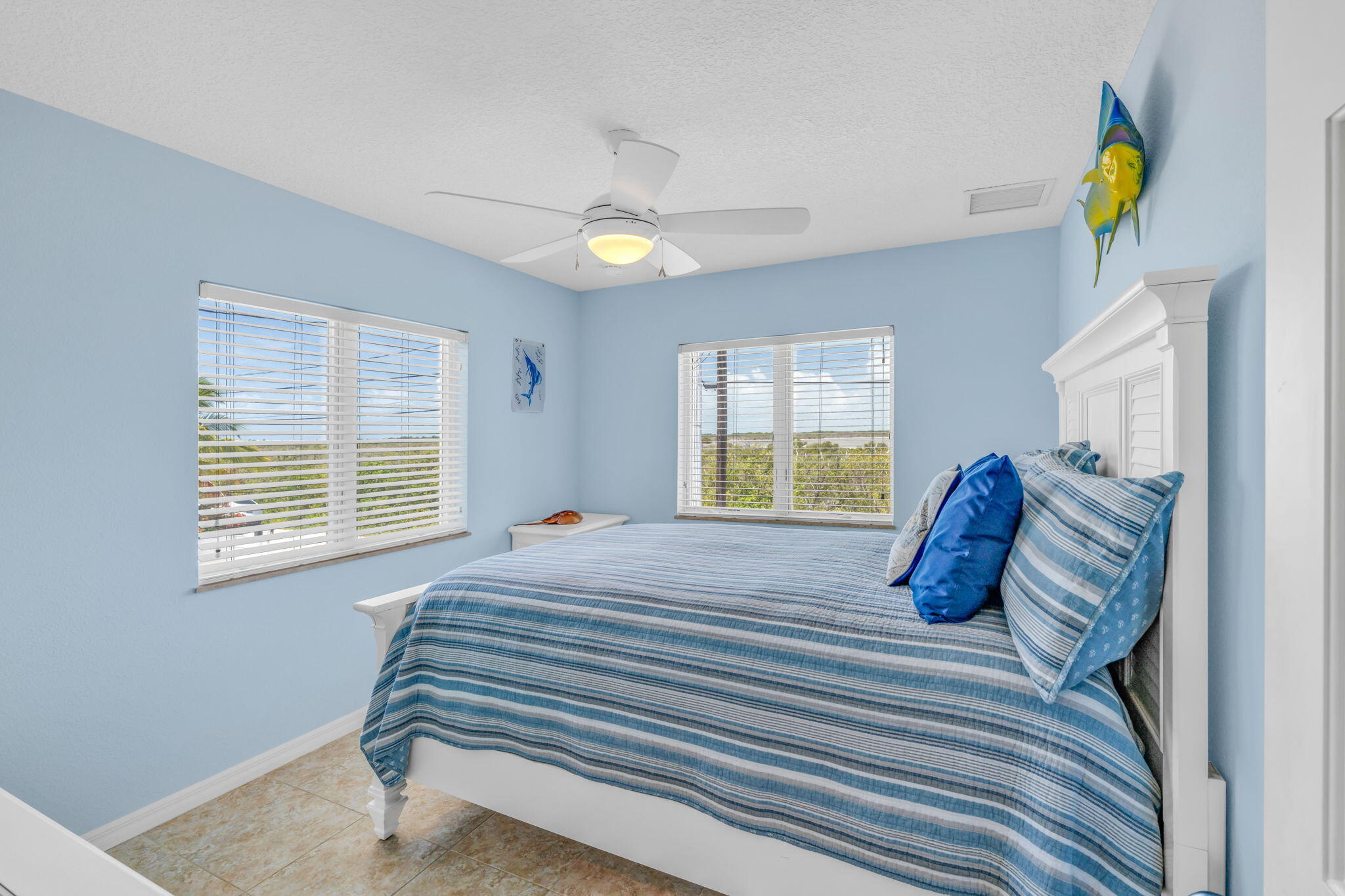 823 Indies Road Summerland Key, FL 33042 - Photo 22 of 48 a bedroom with a bed and a window