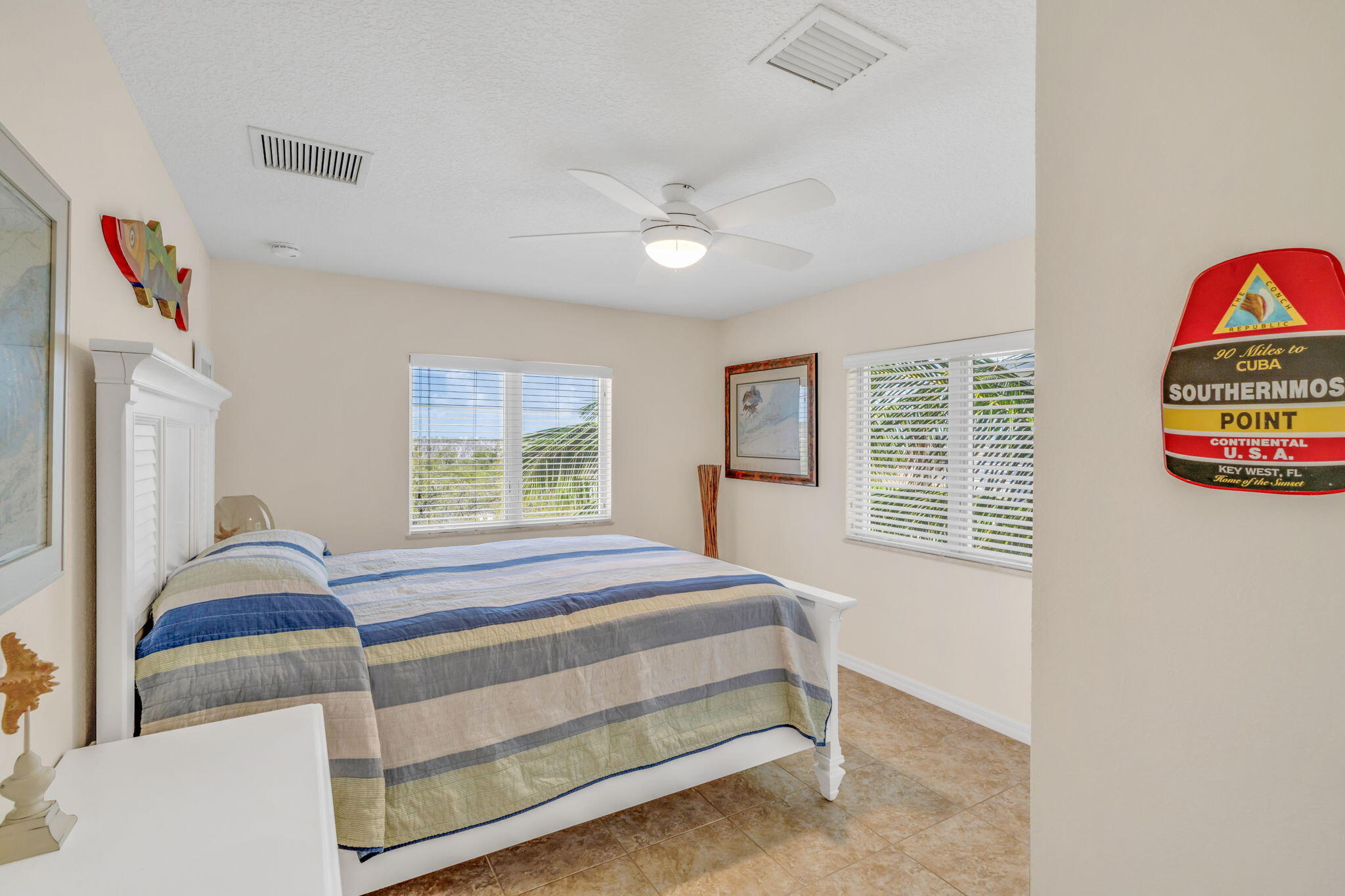 823 Indies Road Summerland Key, FL 33042 - Photo 24 of 48 a bedroom with bed and a window