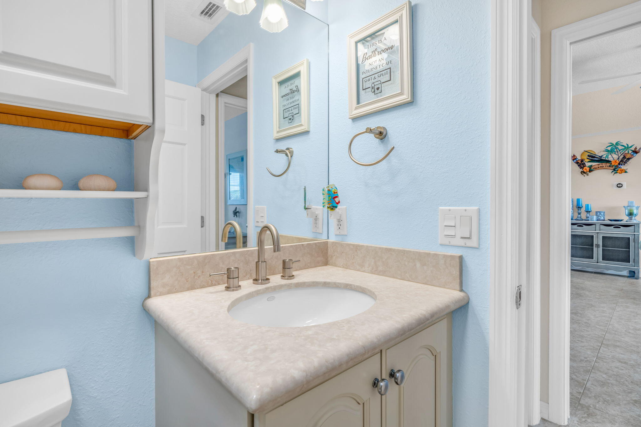 823 Indies Road Summerland Key, FL 33042 - Photo 26 of 48 a bathroom with a sink and a mirror