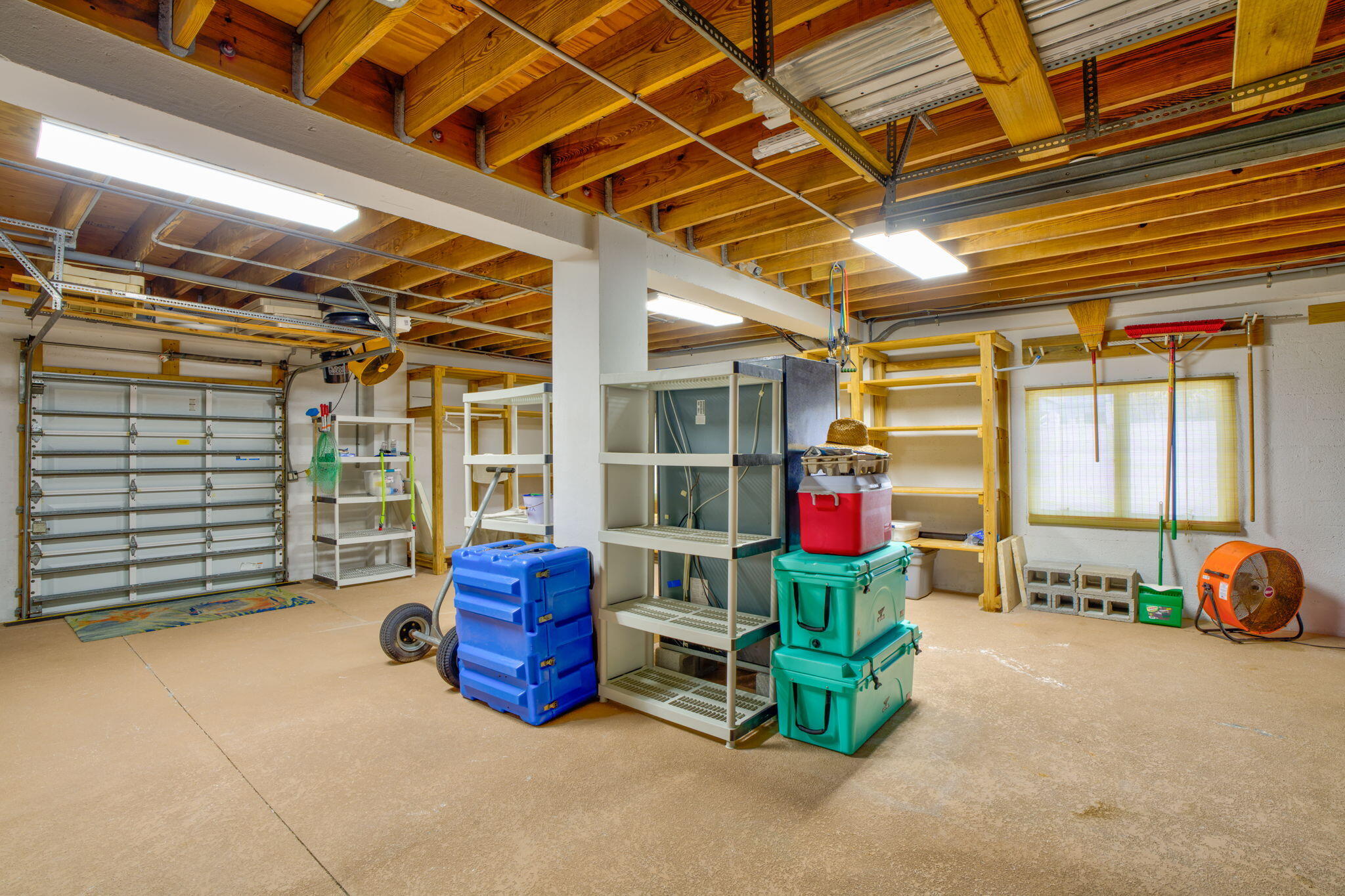 823 Indies Road Summerland Key, FL 33042 - Photo 29 of 48 a backyard of a house with barbeque oven table and chairs